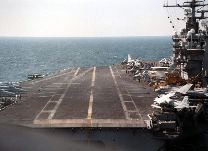 page 171. Photograph of the carrier deck in daylight.